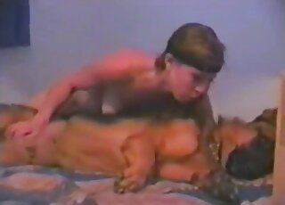 Sexy blonde gets to stroke an animal's penis in a passionate way