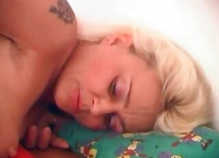 Hot blonde bends down and receives a dog's erected cock in her twat